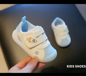 Detail showing toddler walking shoes with a soft jelly sole and cute rocket space theme.