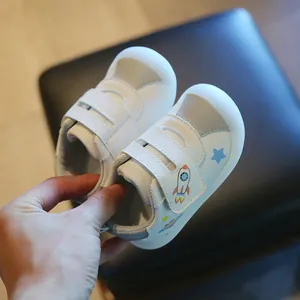 Toddler white walking shoes with rocket print, anti-slip soft jelly sole and velcro straps