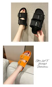 Close-up of stylish canvas buckle slide sandals in classic black and vibrant orange colors