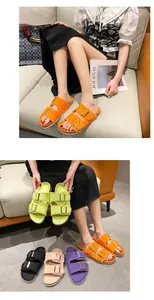 Detailed view of women's frayed canvas buckle slides in various vibrant colors