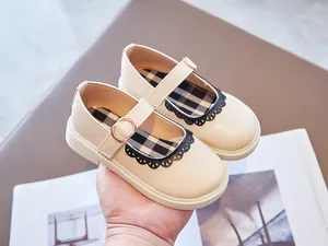 Elegant beige girls Mary Jane shoes with delicate lace trim and classic plaid lining.