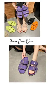 Detailed view of colorful canvas buckle sandals with frayed edges and metal fasteners