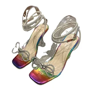 Glitzy iridescent square toe sandals with rhinestone bow and wrap-around ankle straps