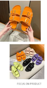 Multi-color women's canvas slides with adjustable buckle straps and frayed edges