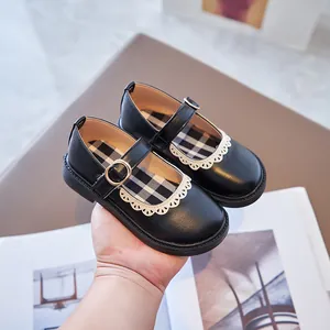 Classic black Mary Jane leather shoes for girls with white lace trim and plaid lining.