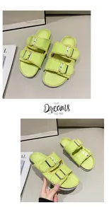 Close-up detail of stylish lime green canvas flat sandals featuring adjustable metal buckles