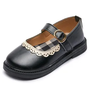 Classic black girls' Mary Jane shoes with scalloped trim and gold buckle