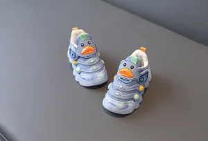 Close-up of breathable baby walker shoes with cute cartoon duck design and soft sole