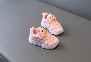Detail view of pink toddler LED light-up shoes featuring a cute cartoon duck design