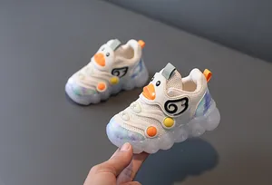 Detailed macro shot of baby LED shoes with breathable mesh and cute duck design.