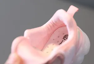 Close-up detail of soft pink breathable lining and insole of a baby girl sport shoe