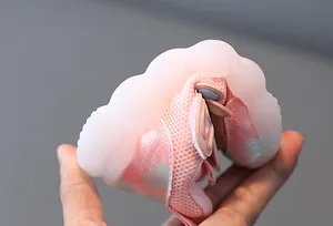 Detailed close-up showing the flexible and soft sole of breathable pink mesh baby walking shoes
