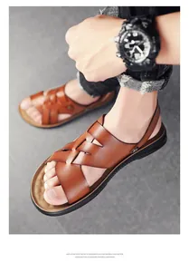 Men's brown leather sandals with woven cross straps and lightweight EVA sole.