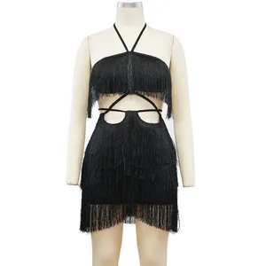 Detail front view of a black fringe halter dress with cutout details on mannequin