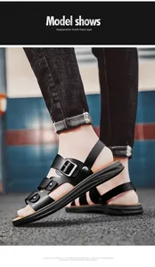 Detailed side view of men's breathable black leather sandals with adjustable metal buckles