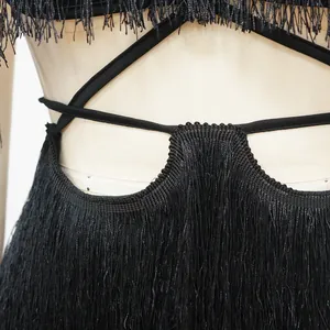 Close-up of black fringe tassel bodycon dress with backless bandage design for women