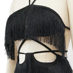 Close-up detail of black fringe tassel texture on a strappy backless party mini dress