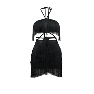 Detail of a black fringe bodycon dress featuring halter neck and wrap-around waist.