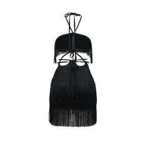 Back view detail of a sexy black fringe halter dress with intricate tie-up bandage design