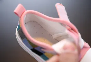 Detailed close-up showing the breathable mesh insole of kids color-block canvas shoes