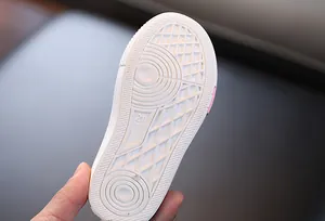 Close-up detail of the durable non-slip white rubber sole on kids canvas shoes