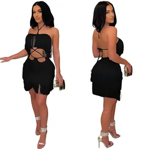Detailed view of black fringe layers and halter neck strapping on sexy backless nightclub dress