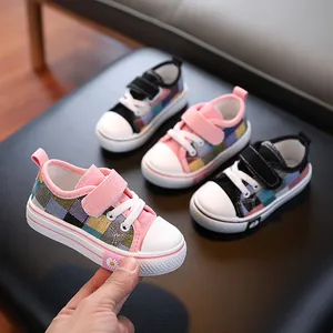 Colorful checkered low-top canvas shoes for kids with non-slip soles and daisy detail