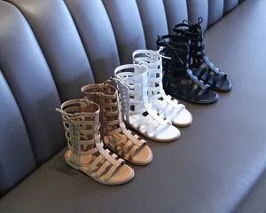 High-top Roman sandals for children in khaki, white, and black with side zippers.