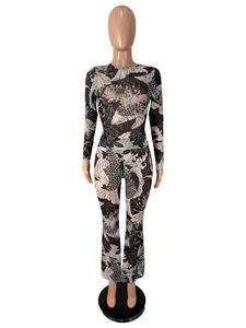 Two-piece set featuring koi fish print long sleeve top and matching high waist flared pants