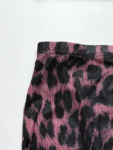 Detailed close-up showing high-waisted cut and pink leopard print fabric texture