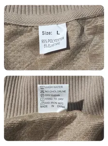 Detailed view of the fabric care label and size tag for men's jacquard knit sweatshirt