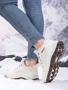 Detailed view of women's warm fur-lined snow boots for winter outdoor activities