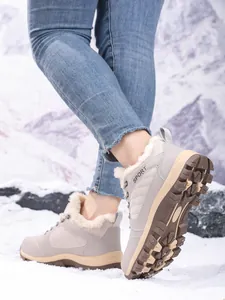 Close-up of women's fleece-lined snow boots showing warm lining and rugged sole