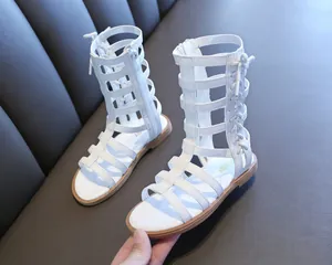 White high-top gladiator sandals for girls featuring a side zipper and lace-up detail