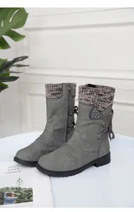 Grey mid-calf boots featuring a cozy knit collar and back lace-up detail with studs