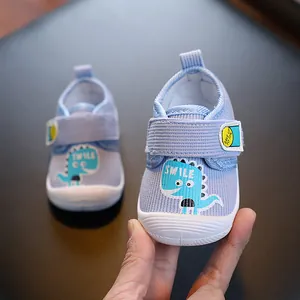 Chaussures de marche bleues pour bébés avec semelle souple et motif dinosaure