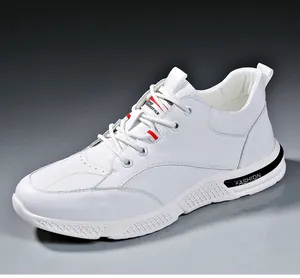 Detailed view of stylish white leather sneakers with soft sole and breathable design.