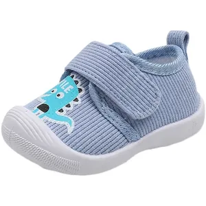 Chaussures souples premier pas pour bébé en tissu rayé bleu avec dinosaure