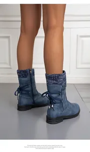 Stylish blue flat women's boots with knit collar and decorative back laces detail.