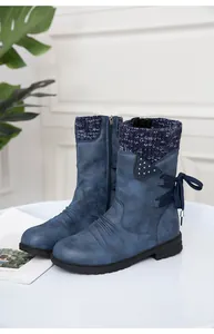 Close-up view of blue distressed leather boots with knitted collar and bow detail