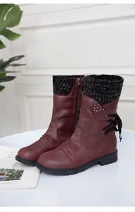 Burgundy women's boots with knitted collar and studded strap details.