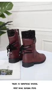 Detailed rear view of burgundy women's winter flat ankle boots with black knit collar