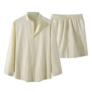 Detail view of men's minimalist off-white long-sleeved linen shirt and matching shorts set