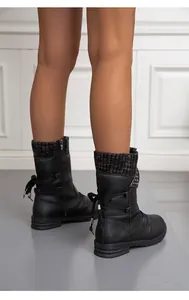Detailed rear view of stylish black mid-calf boots with knit cuffs and back bow accents