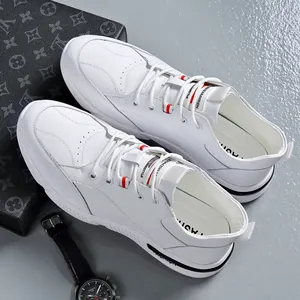 Modern white leather sneakers for men with a breathable design and soft rubber sole