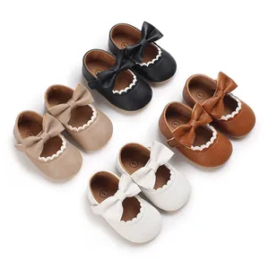 Variety of baby Mary Jane walking shoes with bows and scalloped edges
