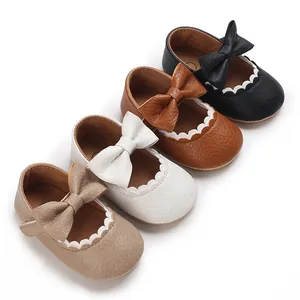 Detailed view of baby soft sole walking shoes featuring elegant bows in four classic colors