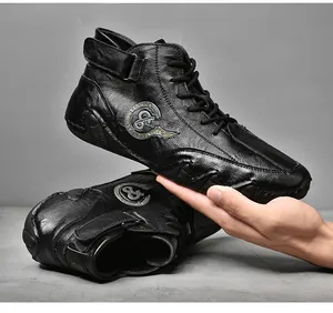 Macro shot of hand-stitched black leather casual mid-top men's shoes with Velcro