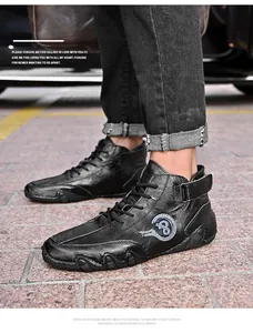 Close-up of black hand-stitched leather mid-top casual shoes with Velcro for men