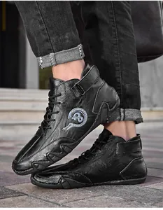 Detailed shot of black handmade stitched men's mid-top leather casual driving shoes